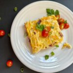 Serving of Amish Breakfast Casserole on a plate.