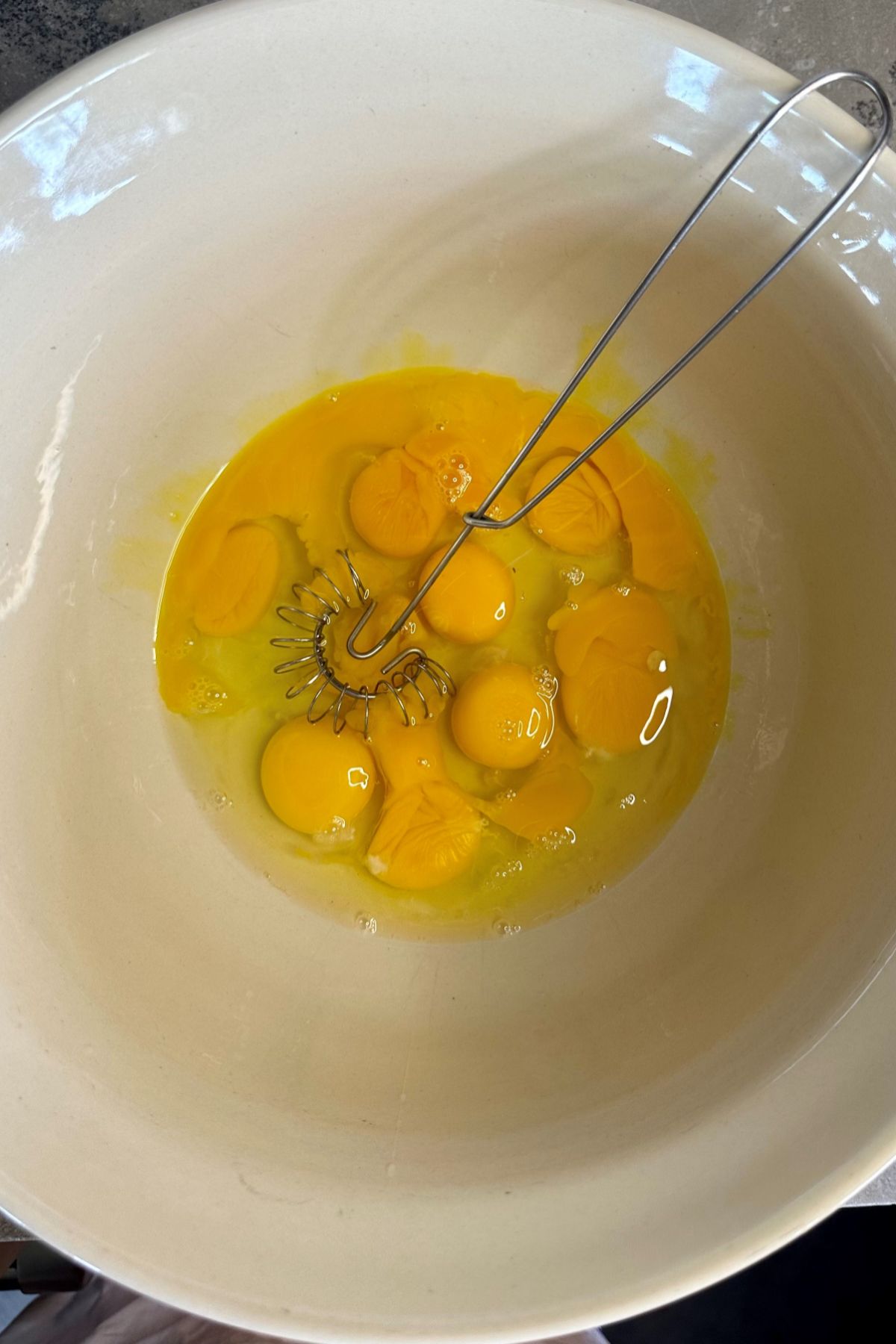 Whisking eggs in a bowl.