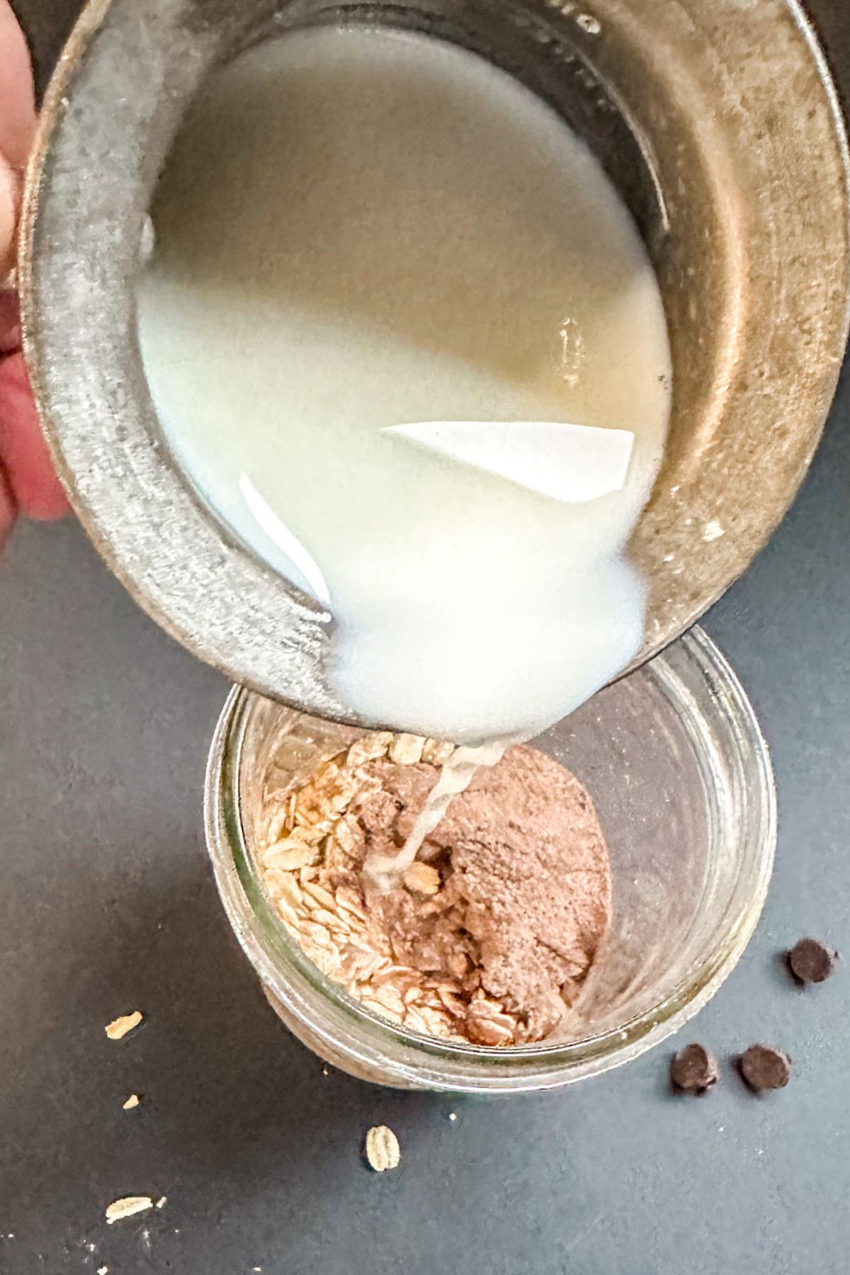Adding milk into Overnight Oats dry ingredients.
