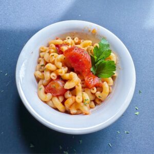 Serving of Macaroni and Tomatoes in a bowl.