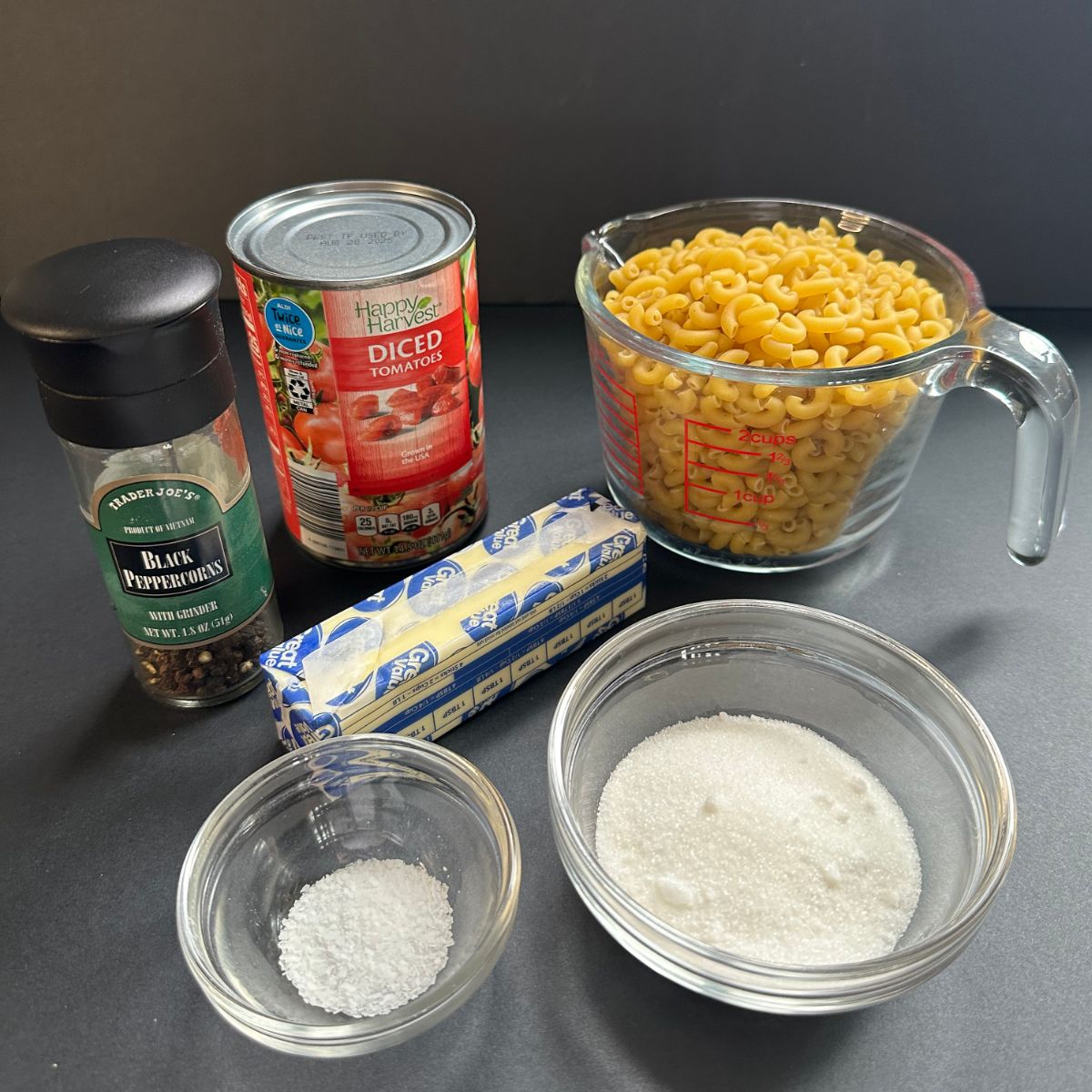 Ingredients to make Macaroni and Tomatoes.