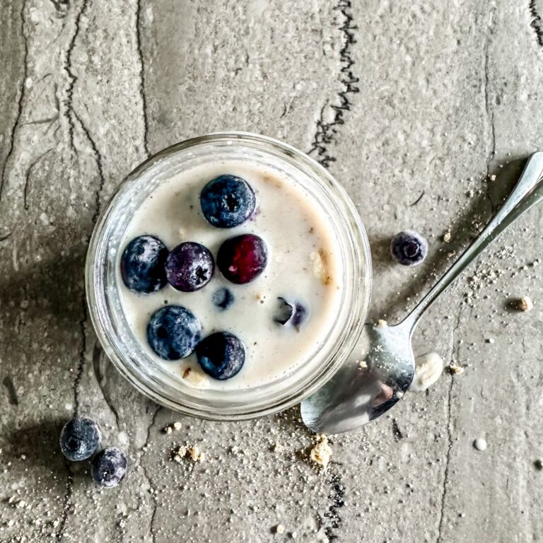 Jar of finished Overnight Oats with Frozen Fruit.