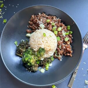Serving of Quick Korean Bulgogi with rice and broccoli in a bowl.