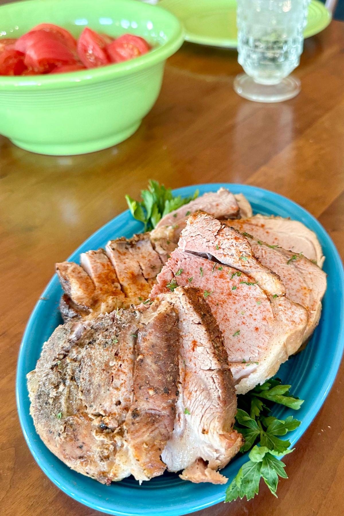Plate of Sous Vide Pork Roast with parsley.