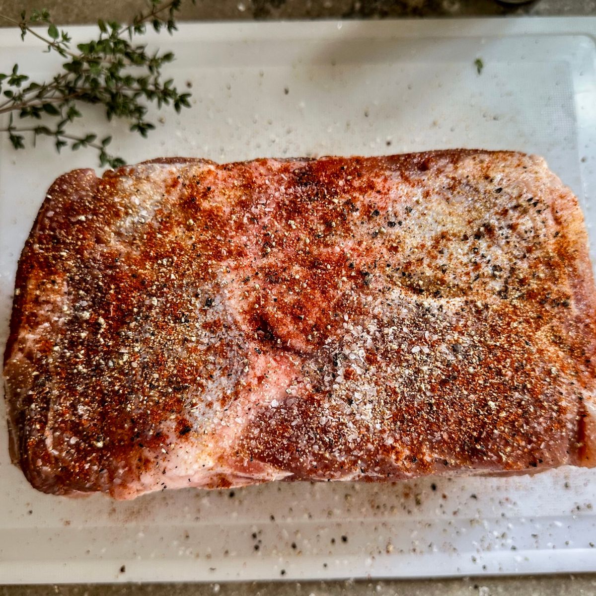 Seasoned Pork Roast on a cutting board.