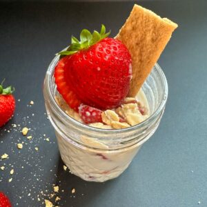 Finished Strawberry Cheesecake Overnight Oats in a jar.