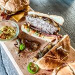 Sweet and Spicy Bacon Burger cut in half.