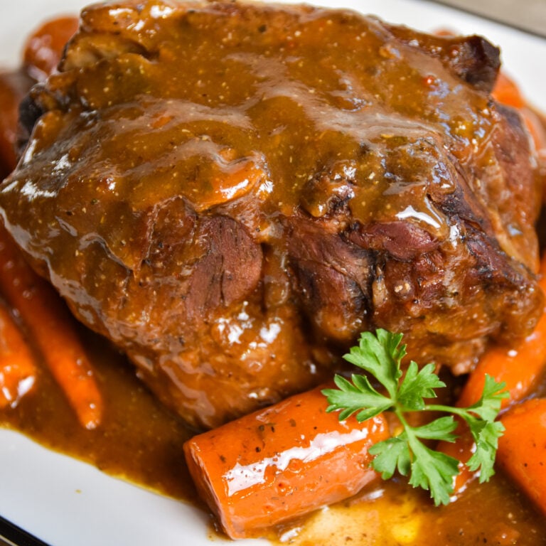 Finished beef pot roast with seasonings.