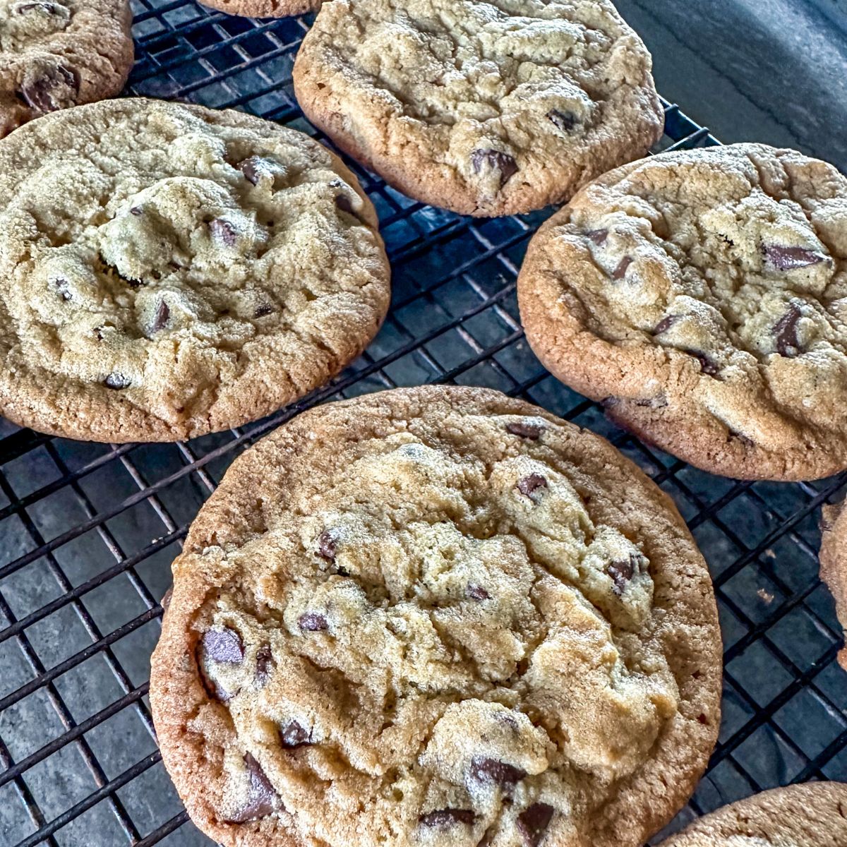 Baked Bacon Grease Chocolate Chip Cookies on a cooling rack.