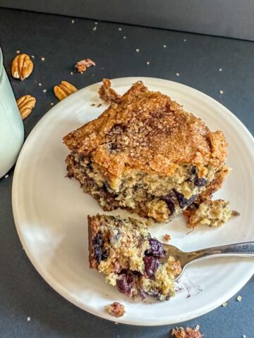 Serving of Blueberry Banana Bread with milk.