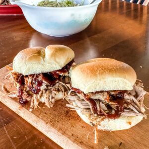 Two ready to eat Pork Butt sandwiches.