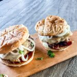 Two Porky Burgers with onions.