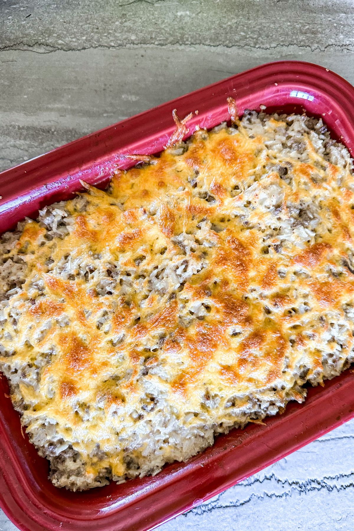 Cheesy Ranch Ground Beef and Rice Casserole with melted cheese.