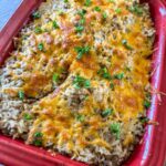 Hamburger and cheesy ranch casserole in baking dish.