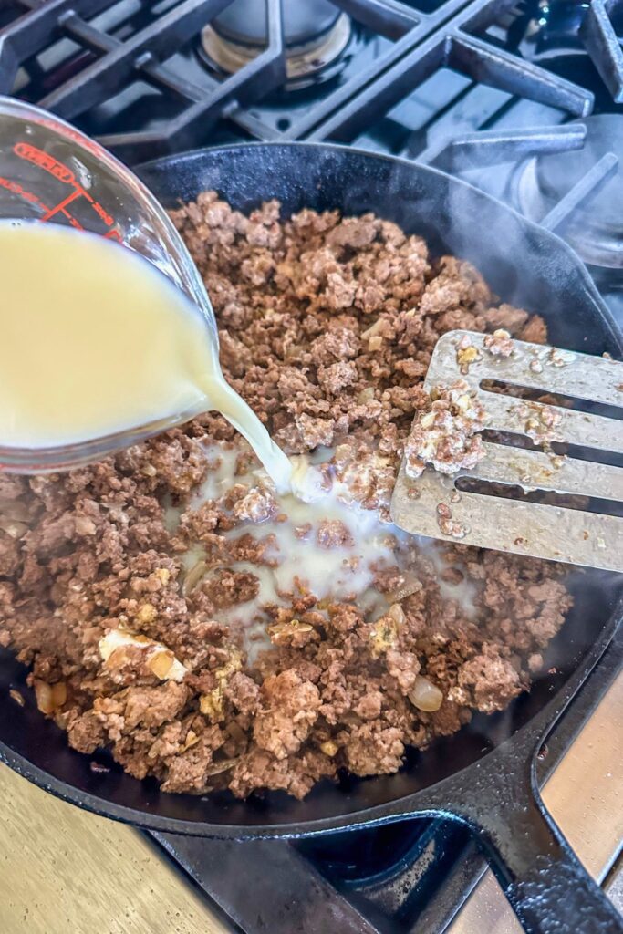 Cooking-the-ground-beef-until-crispy-and-brown Pour the broth over your cooked ground beef.