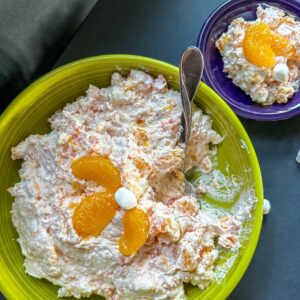 Bowl of Orange Dreamsicle Salad alongside a small serving of the salad.
