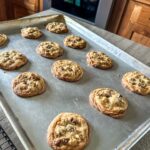 Finished chocolate chip walnut cookies on the pan.