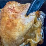 checking the temperature on the turkey.