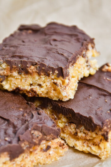 Chocolate peanut butter rice krispie treats stacked.