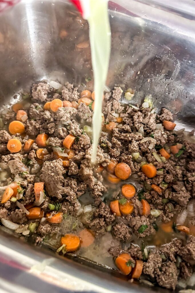 cooking hamburger carrots, celery, onions for instant pot cheeseburger soup.