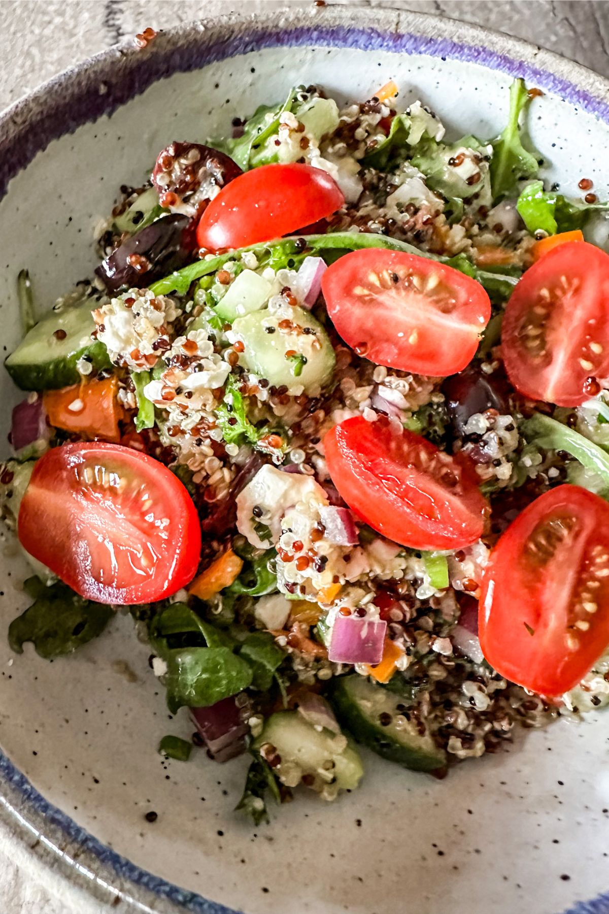 arugula and quinoa salad with yummy red tomatoes.