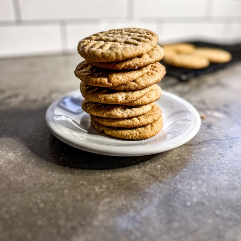 honey, peanut butter cookies on a white plate.