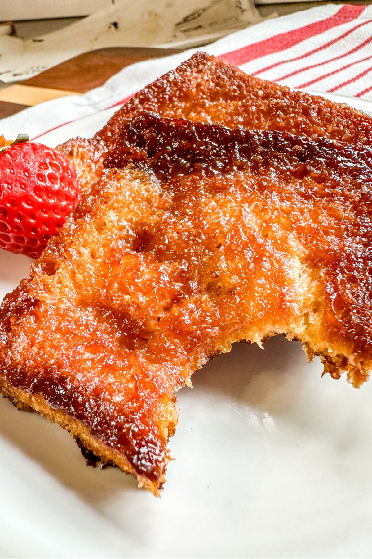 taking a bite out of caramelized honey butter toast.