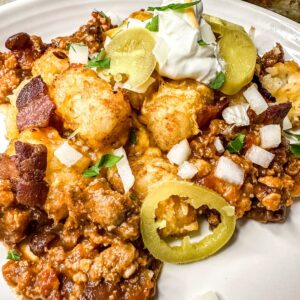beautiful loaded tater tot casserole with onions.