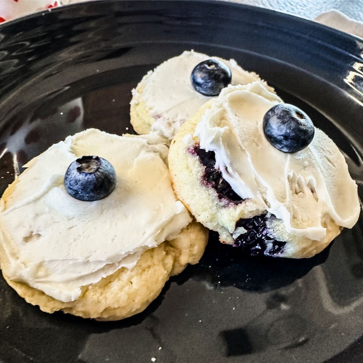 lemon blueberry cookies on a gray plate.