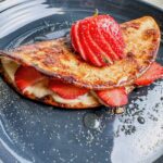 strawberry cheesecake quesadilla with cinnamon sugar on top.