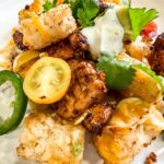 Tachos served on a white plate.