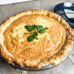 finished golden brown cheesy asparagus and ham quiche.