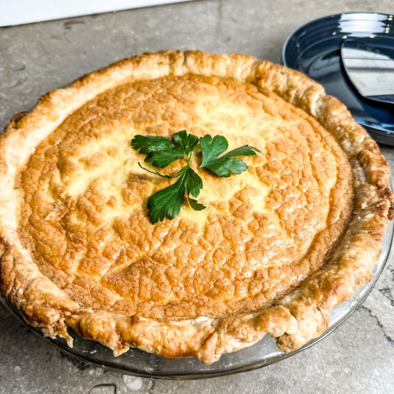 finished golden brown cheesy asparagus and ham quiche.
