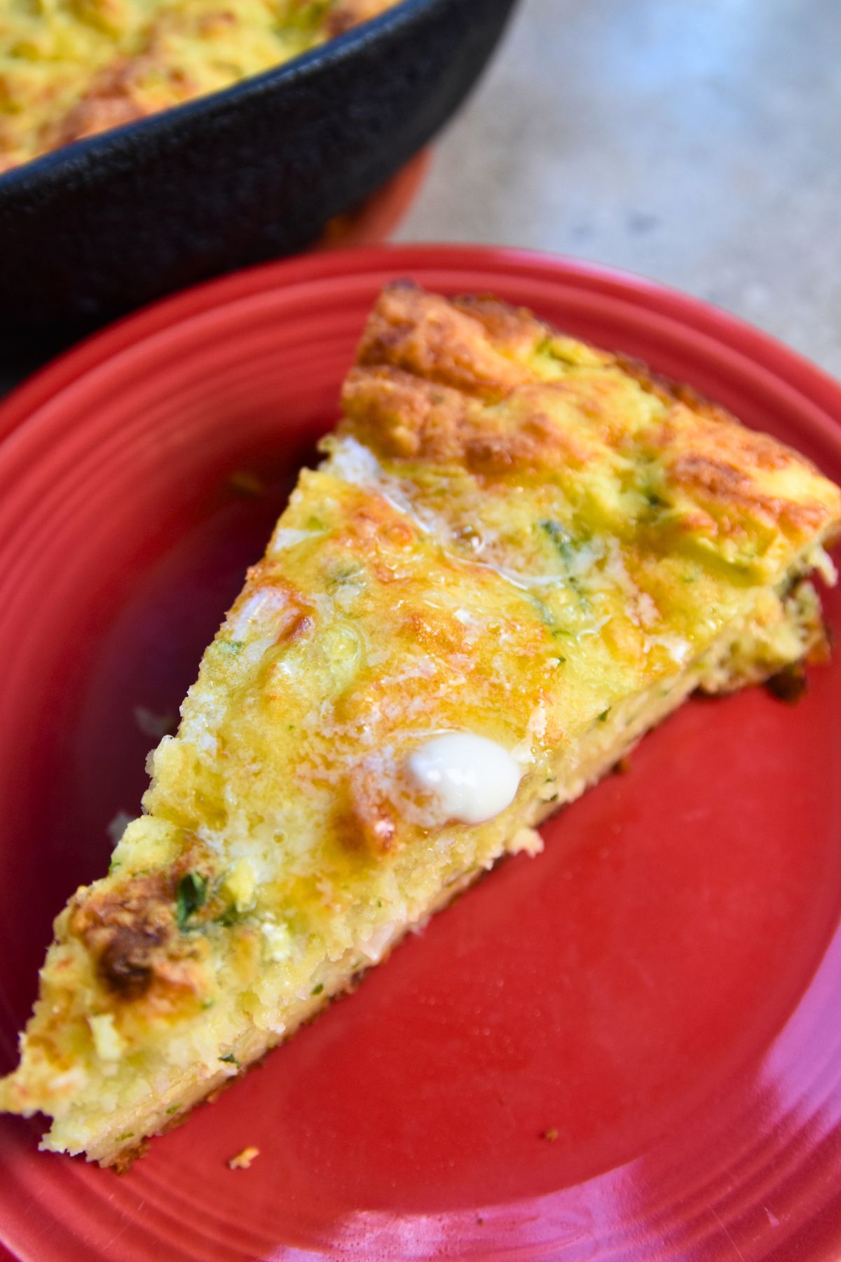Jalapeño-zucchini-bread-topped-with-melted-butter Melted butter on top of a slice of jalapeño zucchini bread.