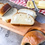 sliced french bread with butter on top.