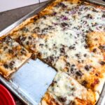 Homemade pizza with ground beef made in a sheet pan.