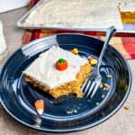 eating sheet pan pumpkin bars with a fork.