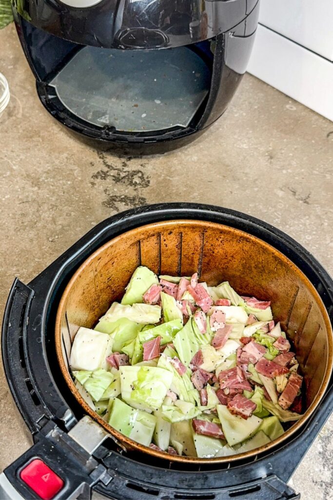 putting the cabbage in the air fryer.