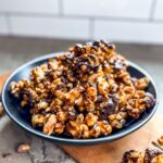 Golden brown chocolate drizzled caramel corn is ready to be served.