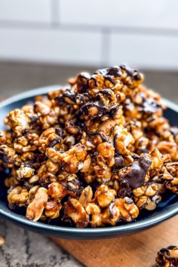Golden brown chocolate drizzled caramel corn is ready to be served.