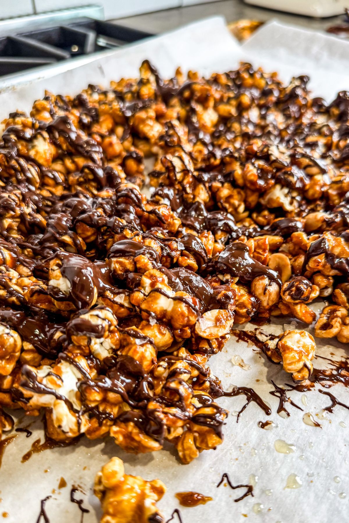 Letting the chocolate dry on top of the caramel corn.