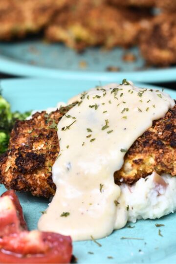Parmesan Crusted Chicken served with a ranch gravy.