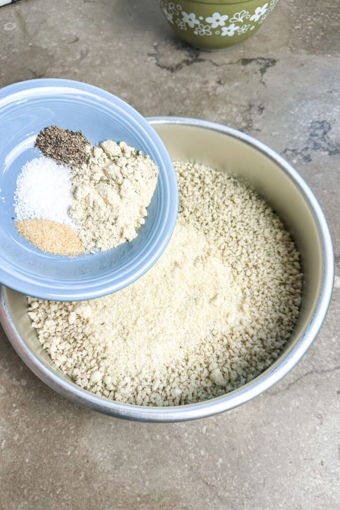 Add your seasonings to the bread crumbs and parmesan mixture.