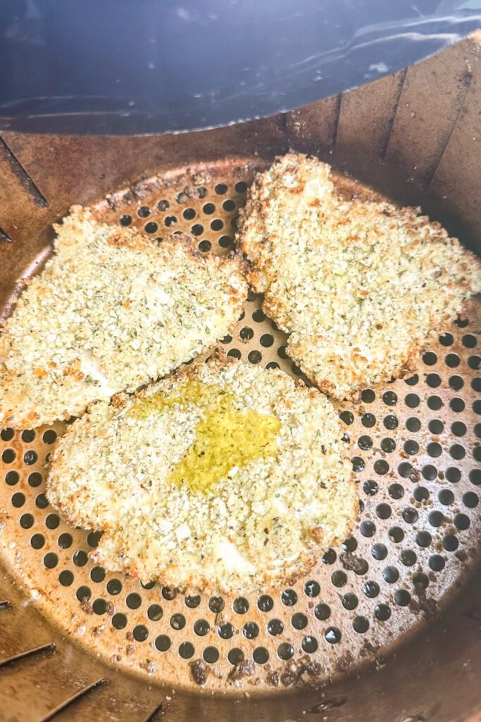 Drizzle olive oil on top of the chicken and put it in the air fryer for 6 minutes.