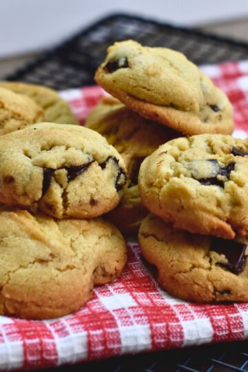 Cookies are served on a red and white towel to guests.