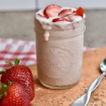 blended overnight oats dripping over the side of the jar.