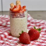 Ready-to-eat strawberry cheesecake overnight oats.