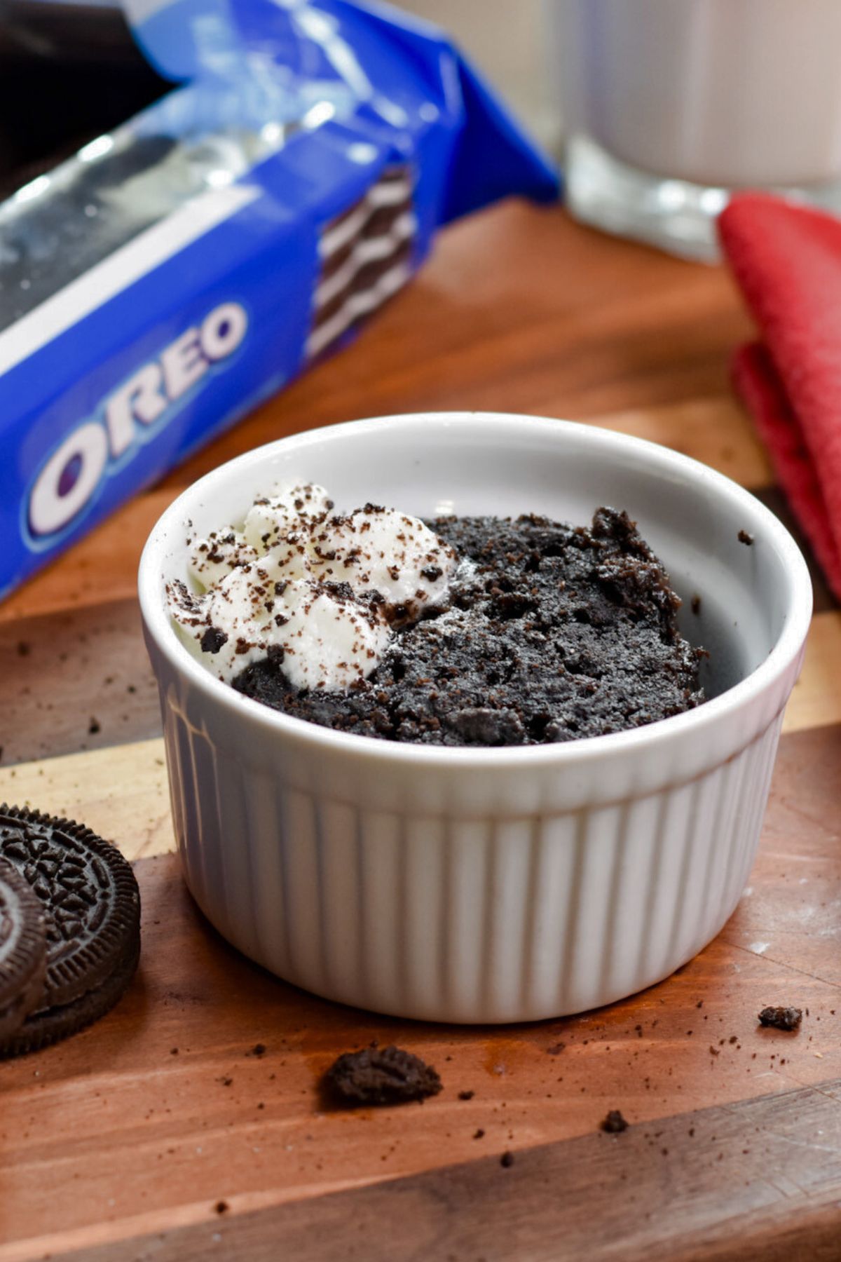 oreo-mug-cake-served-on-a-wooden-table Oreo mug cake finished and served with milk.
