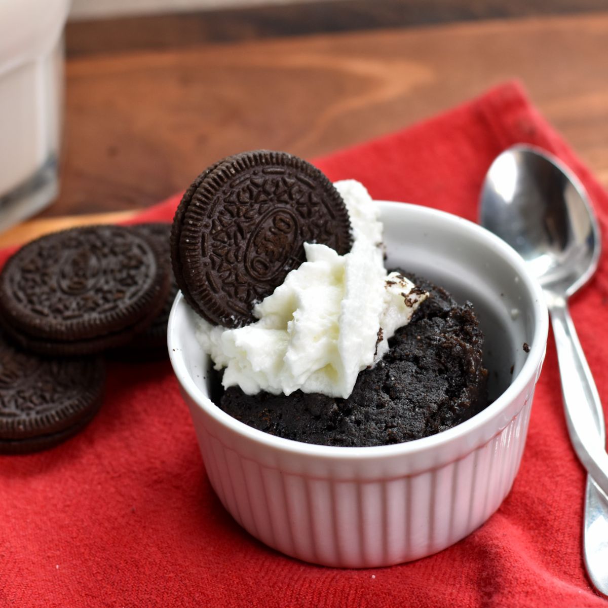 eating the Oreo mug cake with a spoon.