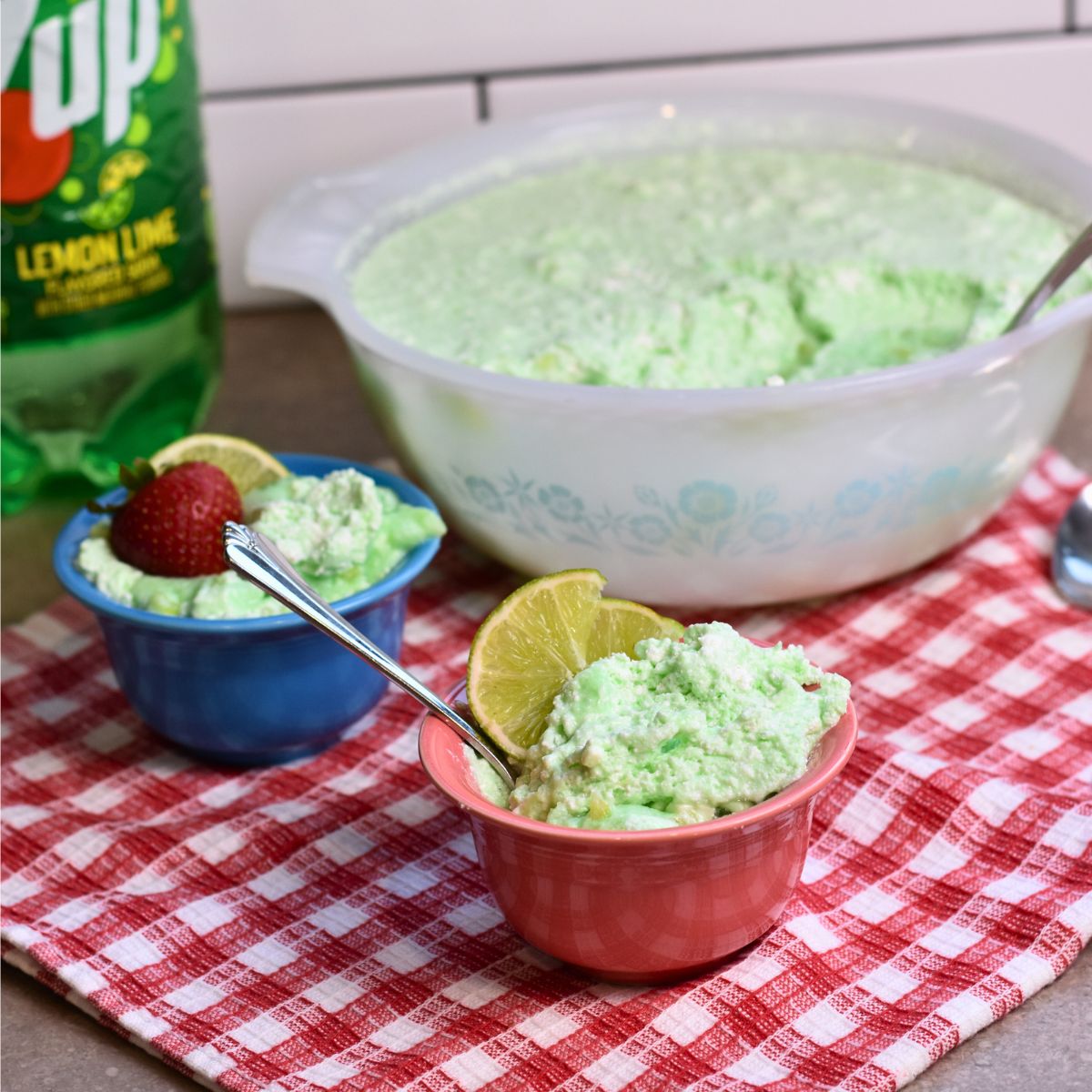 7-up-salad-serving 7UP jello salad served to guests with blue and pink bowls.